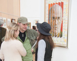 At the exhibition opening with a painting of Irish writer Colm T?ibín by artist Aidan Hickey in the background