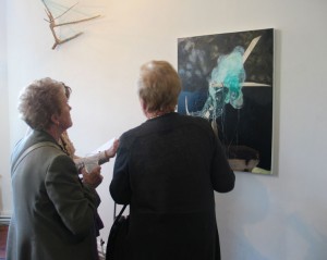 Admiring the work At the Exhibition Opening