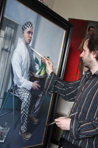 Oisin with his painting of a Polish chef (photo Liam Madden)