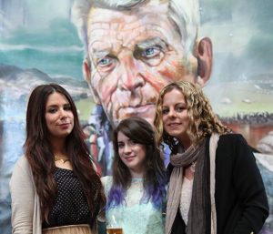 Claire-Michelle O'Connor, Aisling Kennedy and Clare Shanahan at the exhibition opening with Samuel Beckett in the background (photo Liam Madden)